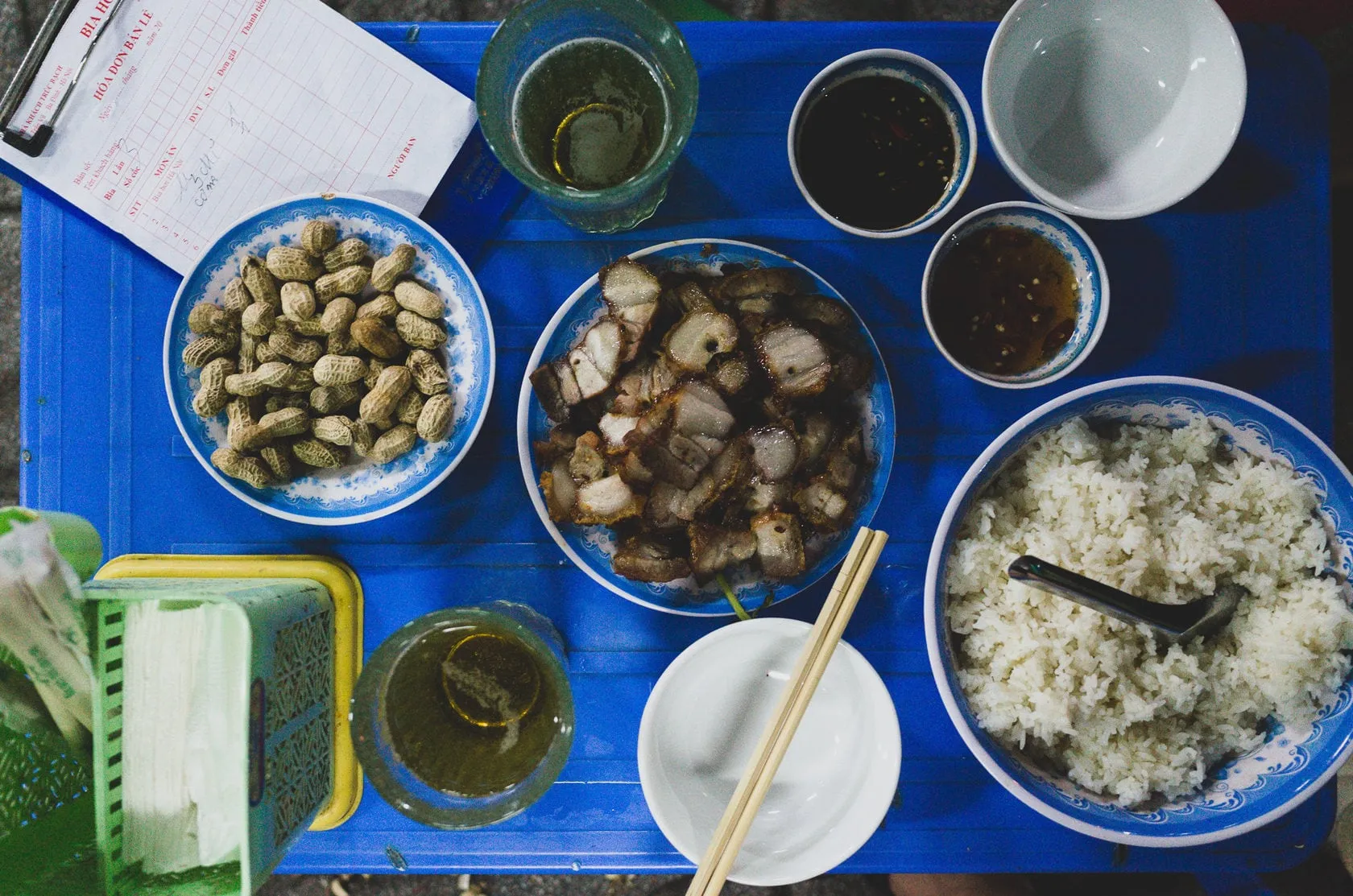 Bia hoi with food on table